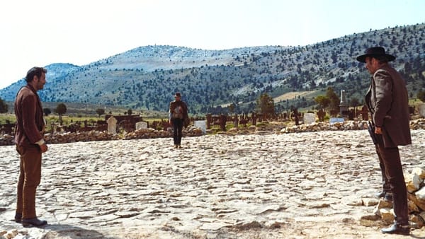 Duel scene from a western movie with three men in a standoff